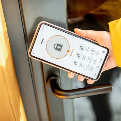 locking-entrance-door-with-a-smart-phone-2025-03-14-12-44-38-utc_11zon