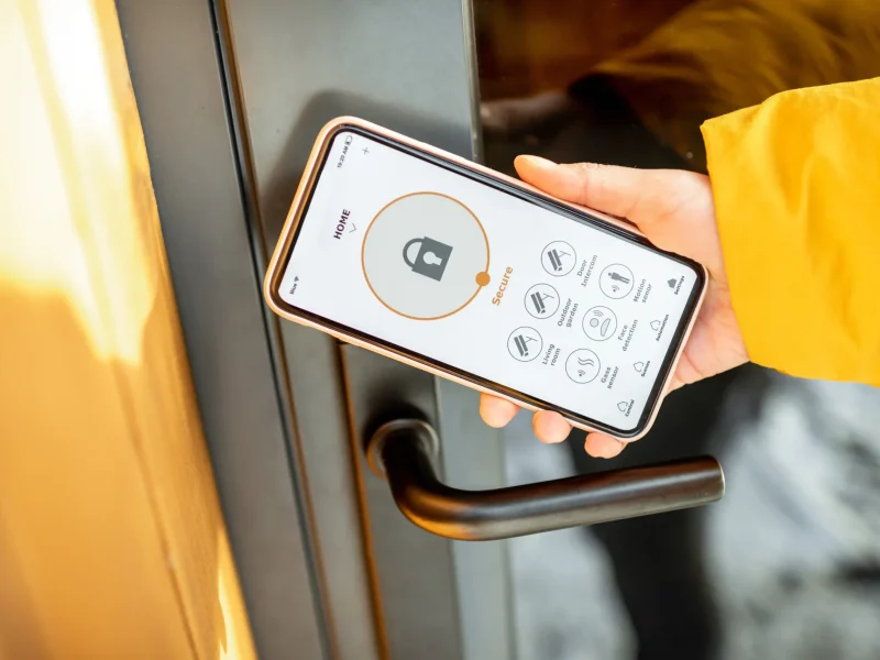 locking-entrance-door-with-a-smart-phone-2025-03-14-12-44-38-utc_11zon
