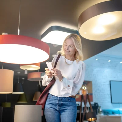 pretty-woman-looking-over-new-lamps-in-a-store-2024-10-18-04-16-20-utc_11zon