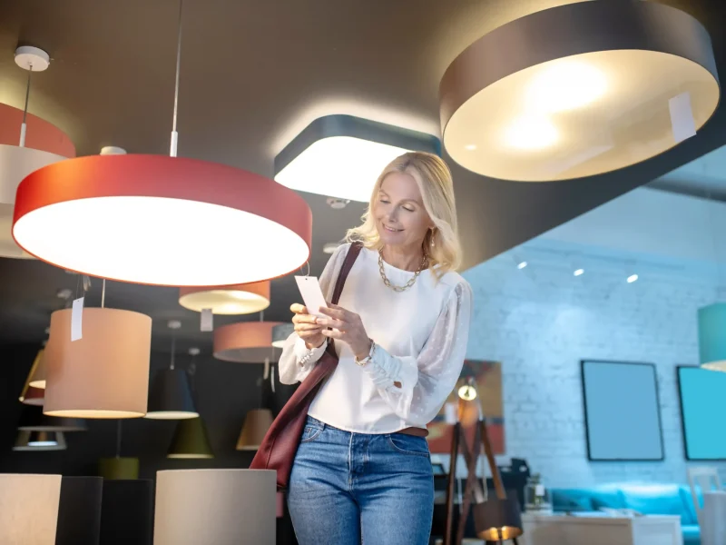pretty-woman-looking-over-new-lamps-in-a-store-2024-10-18-04-16-20-utc_11zon